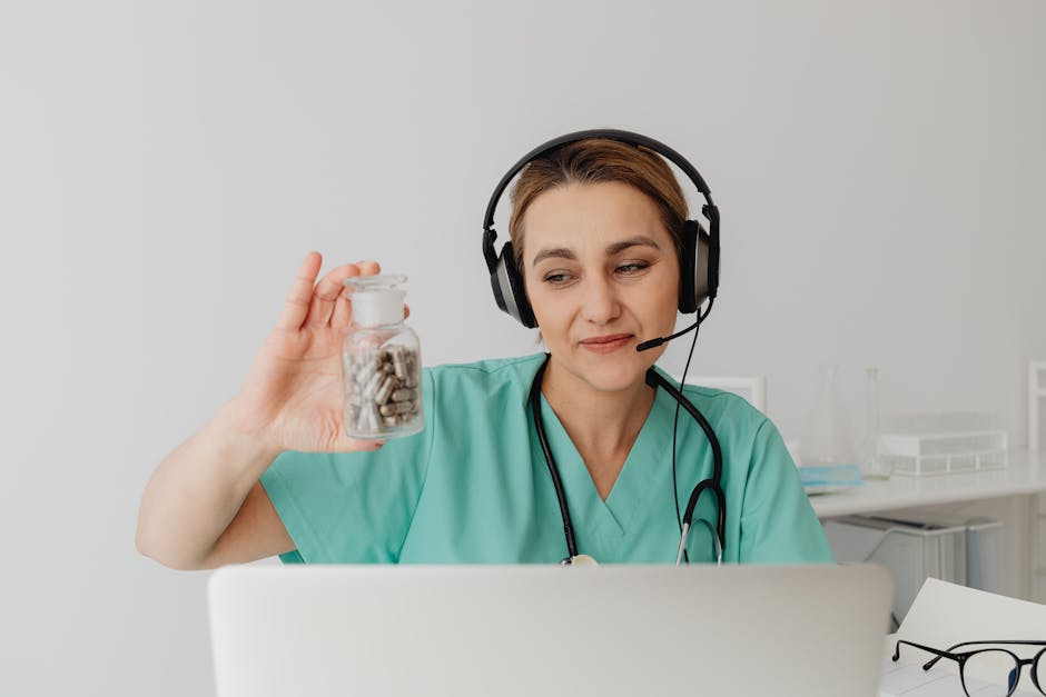 Female doctor in headset conducting online medical consultation showing pills.
